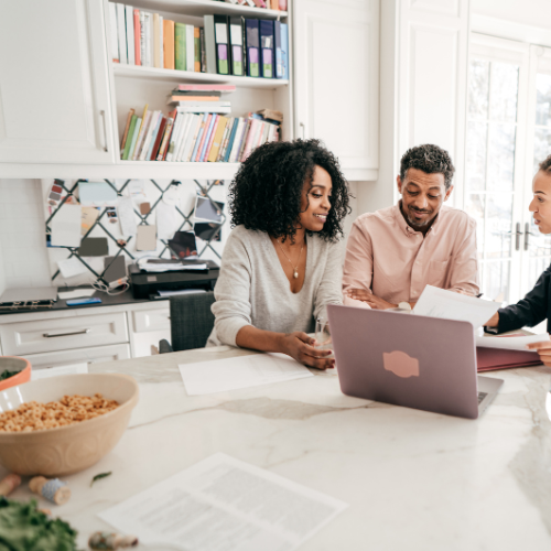 Family reviewing planning documents together at home