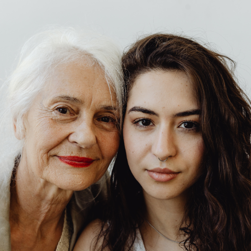 Grandchild supporting elderly grandparent