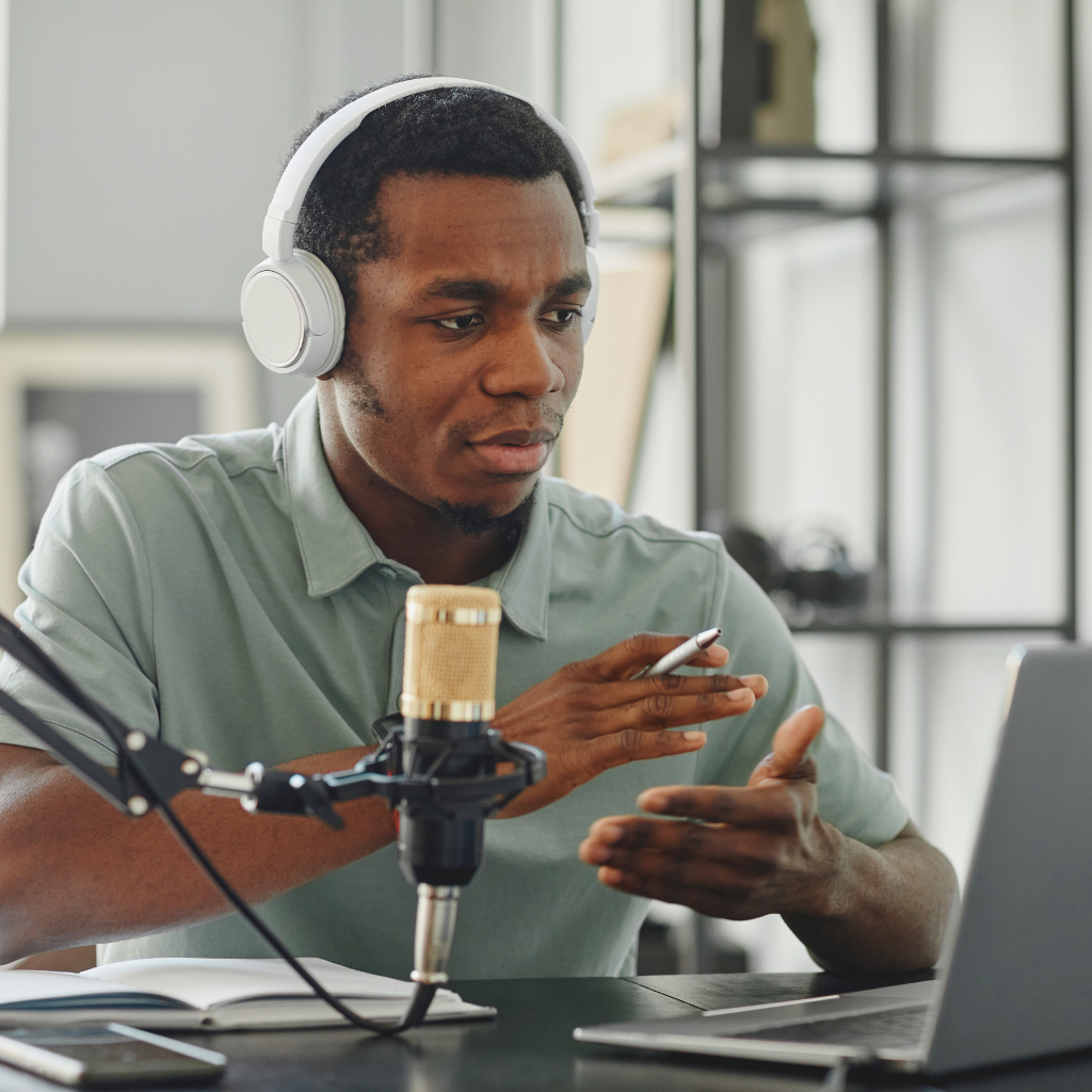 Content creator recording at desk with microphone and laptop – Sista Girl JD Brand Deal Checklist