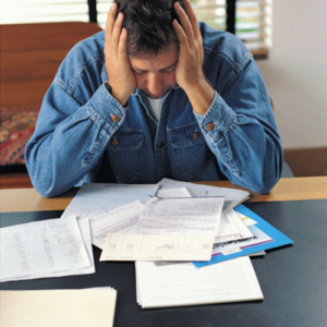 Person reviewing court paperwork and feeling frustrated by a criminal record sealing filing process in Texas